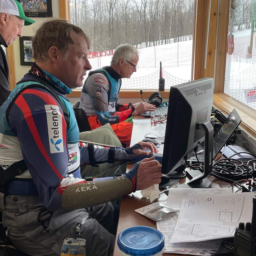 Race officials scoring a race in the timing building
